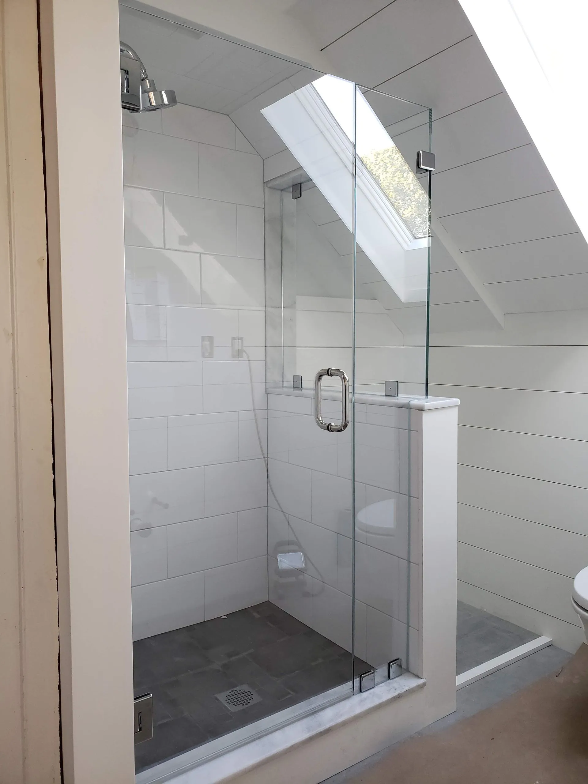 Frameless 90 degree shower with wall-mounted hinges