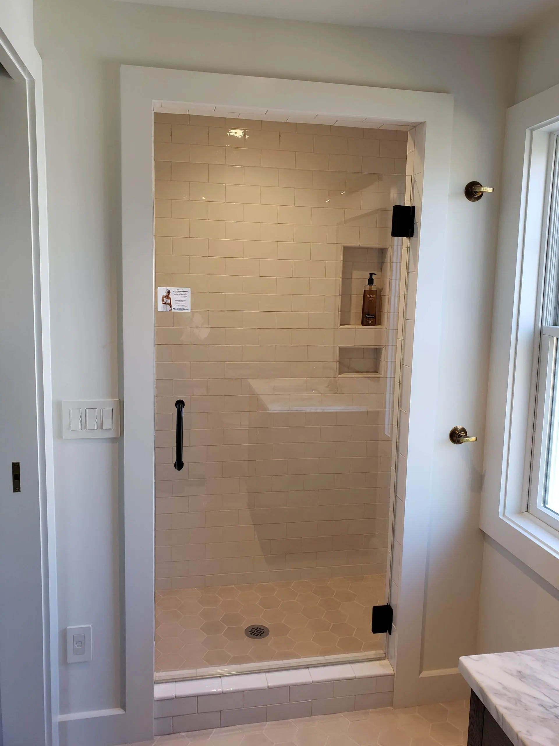 Frameless steam shower enclosure